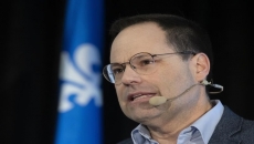 One of two Quebec Liberal leadership candidates drops out, citing lack of money